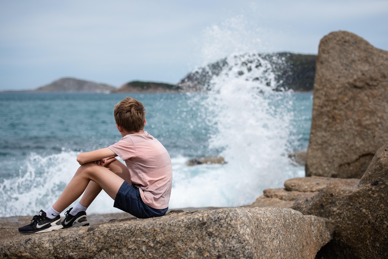 Boy watching ocean